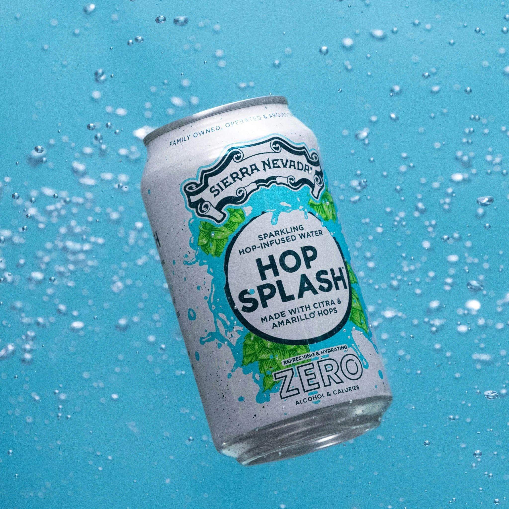 A 12oz can of Sierra Nevada Hop Splash floating in blue bubbly water