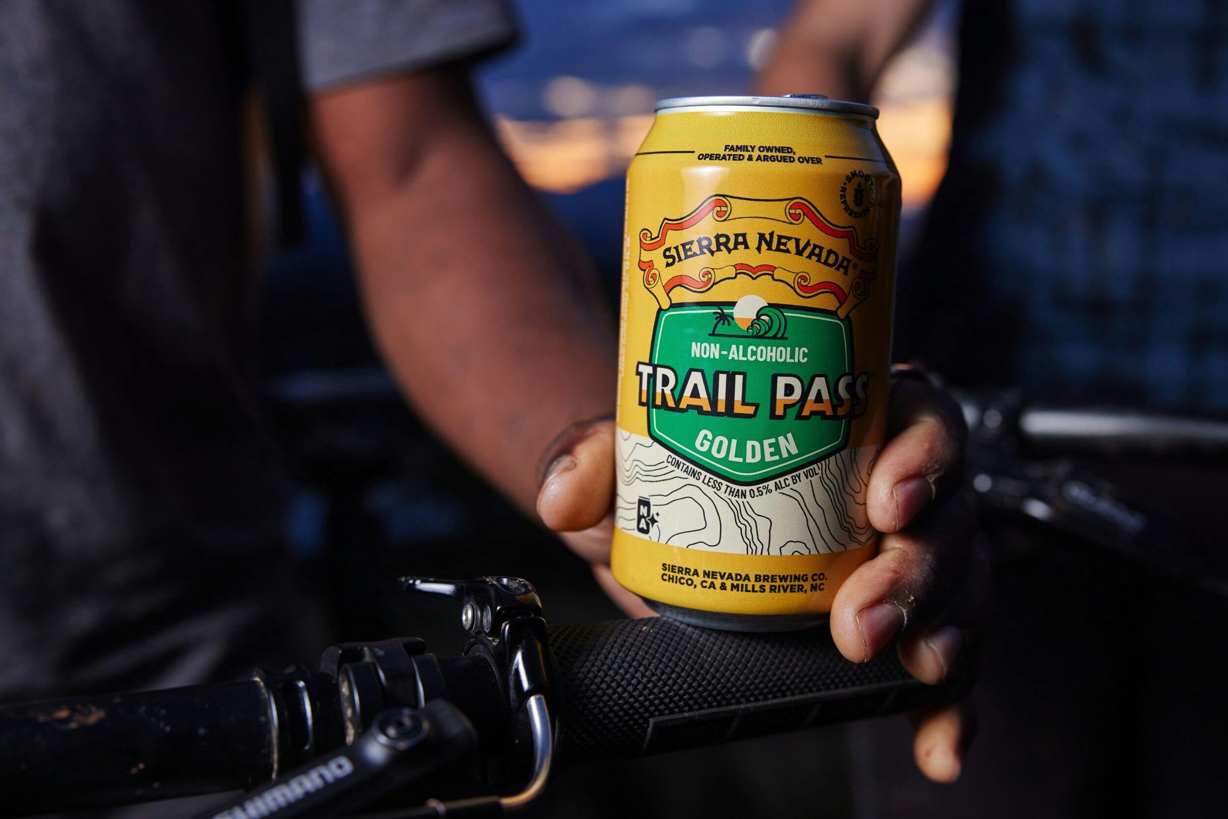 Trail Pass Golden can being held outside