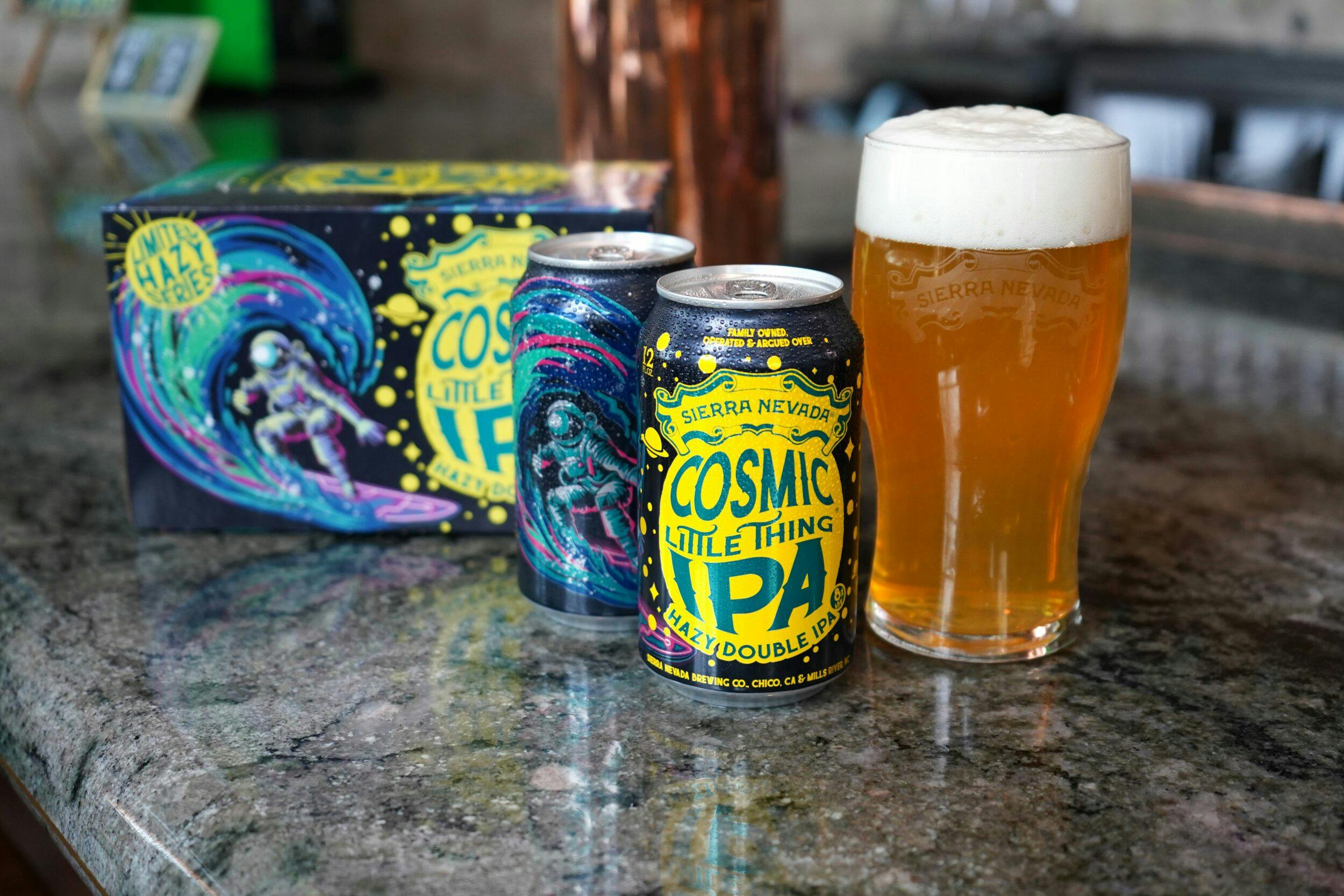 Cosmic Little Thing can, pint and 6-pack on bar counter