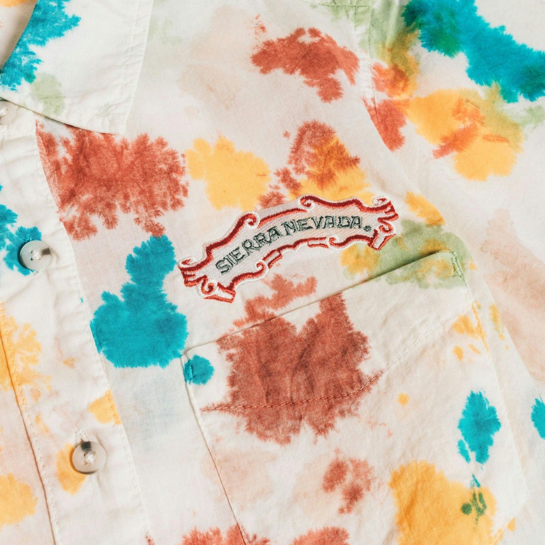 Sierra Nevada X Kavu detail image of embroidered Sierra Nevada logo on the Party Happy Tie Dye button down shirt